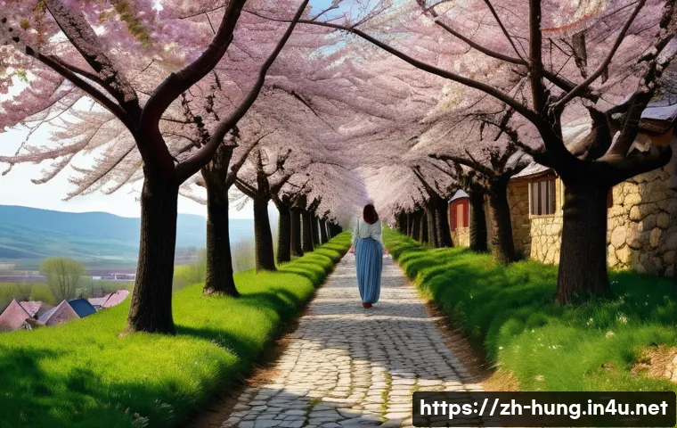 헝가리 나지코팔리 절벽 마을 - **"A breathtaking panoramic view of Nagykövesd Cliff Village in Hungary during the peak of cherry bl...